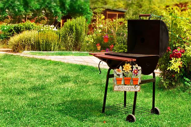 BBQ Grill and WELCOME sign in the Backyard. Background with space for text or image.