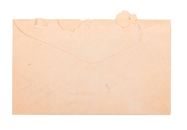 Old Envelope Old envelope torn open at the top and marked over time isolated on white yellowed edges stock pictures, royalty-free photos & images