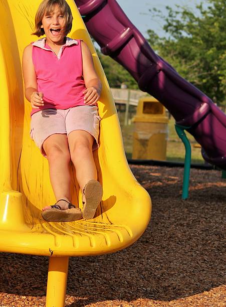istock Girl on a Slide 506934393