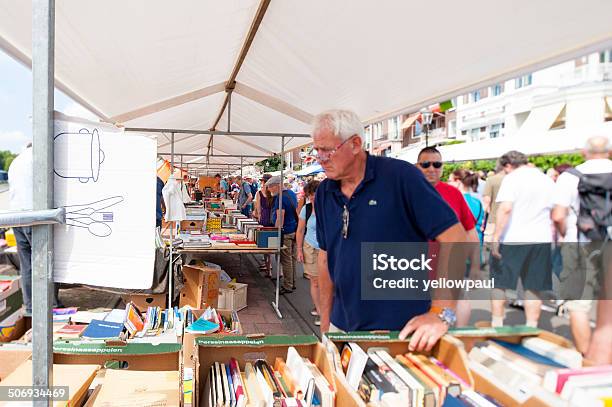 People Shopping At White Book Stalls Stock Photo - Download Image Now - Second Hand Sale, Active Seniors, Ancient