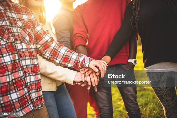 Group Of Teenagers Volunteer Stock Photo - Download Image Now - Community, Hands Clasped, Latin American and Hispanic Ethnicity