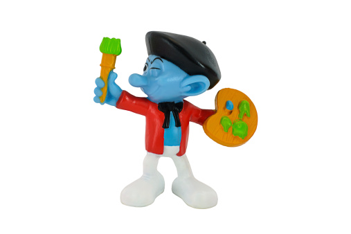 Bangkok, Thailand - June 30, 2014 : Painter Smurf character toy from The Smurf movie.  There are plastic toy sold as part of the McDonald's Happy meals.