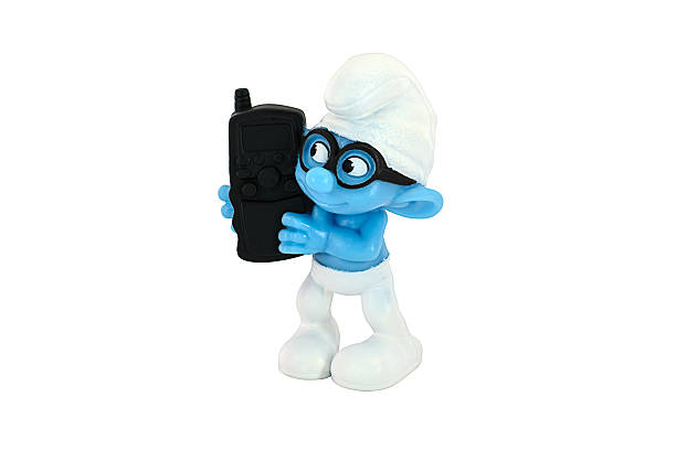 brainy smurf hold a black  cell phone - happy meal stockfoto's en -beelden