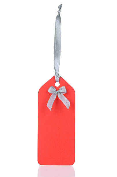 istock cardboard tag with ribbon isolated on white background 506977109