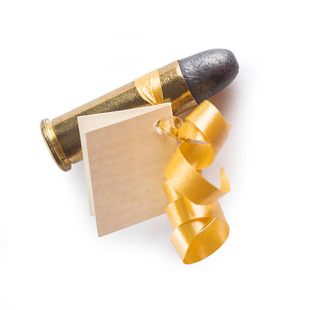 istock Bullet with a card decorated like a gift 506977189