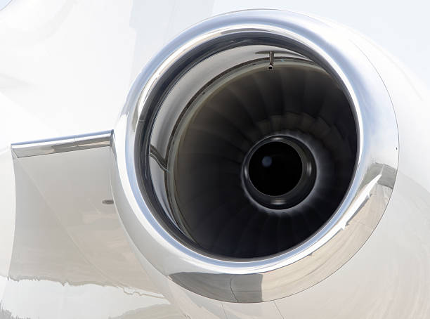 istock Runnning Jet engine closeup on a private airplane - Bombardier 506977553