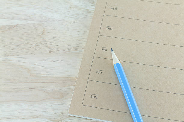 istock note book and pencil on wooden table 506977713