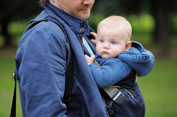 istock Father and his son in a baby carrier 506978751
