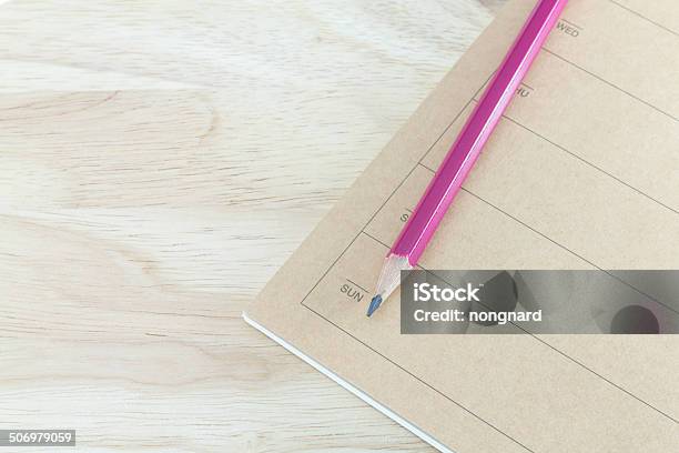 Note Book And Pencil On Wooden Table Stock Photo - Download Image Now - Book, Colors, Desk