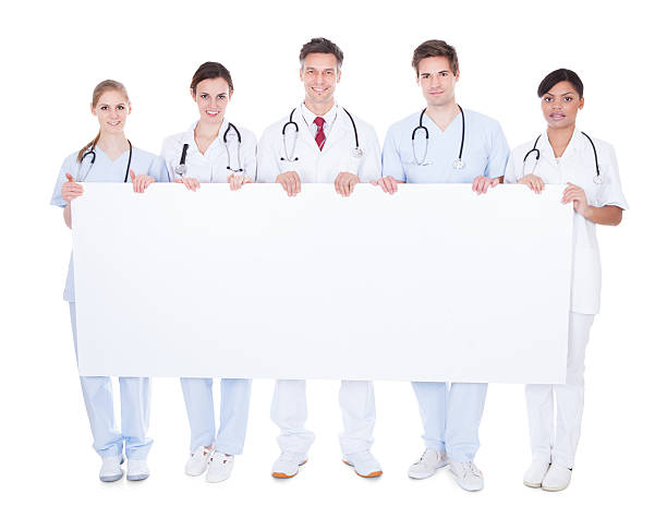 istock Group Of Doctors With Blank Billboard 506979201