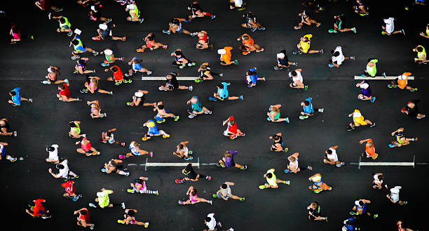 Running overhead shot of marathon sports race photos stock pictures, royalty-free photos & images