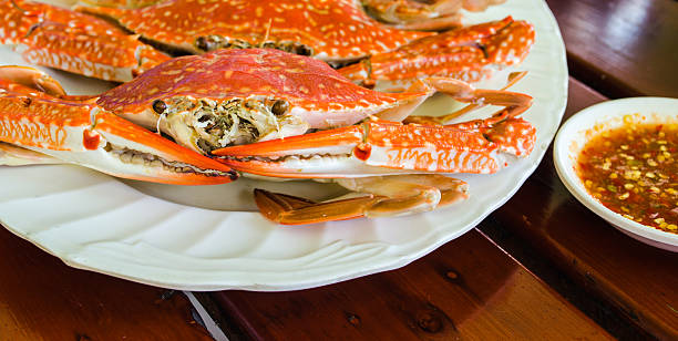istock Boiled crab on plate. with seafood sauce. 506979757