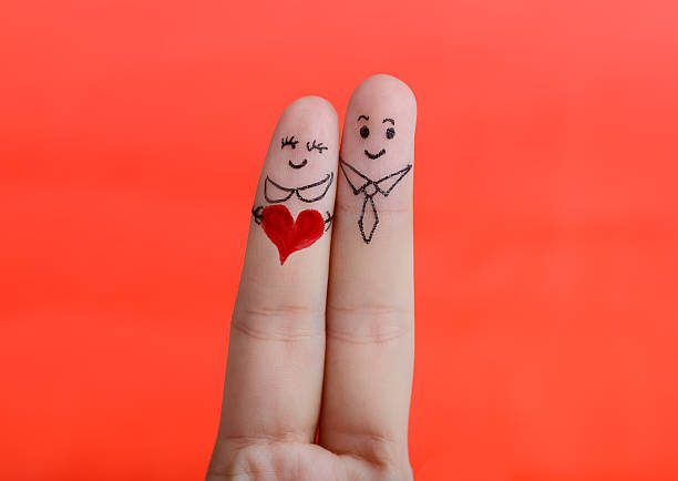 istock Painted finger smiley on red background, valentine concept. 506980289
