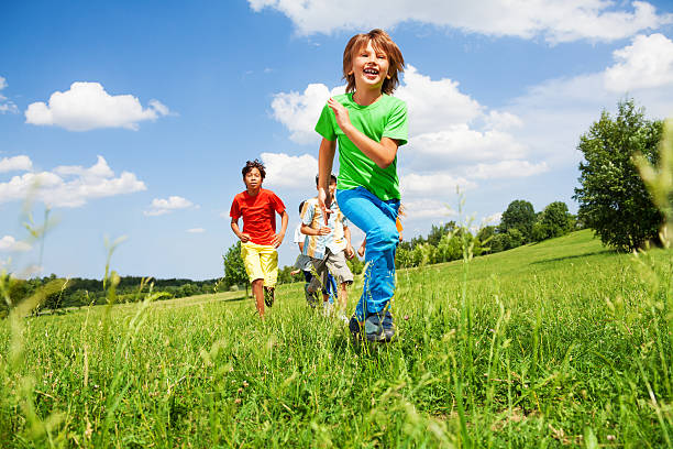 The child goes in for sports at the stadium. The boy training before playing football. High quality photo