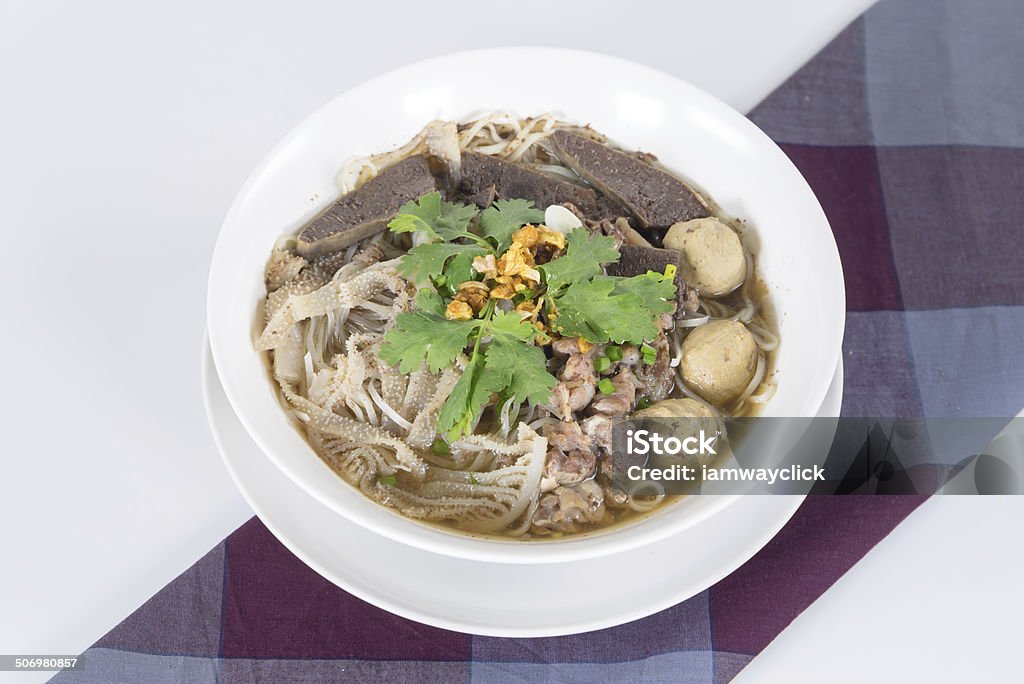 Combination Beef Noodle with beef ball, beef tripe, beef liver Combination Beef Noodle with beef ball, beef tripe, beef liver, BBQ Duck, Bean Sprouts, Green Lettuces, Green Onions, Cilantro, spicy sour minced jalapeno and Dried Garlic Animal Digestive System Stock Photo