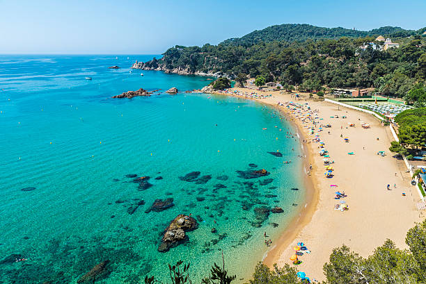 Santa Cristina beach, Catalonia, Spain Overview of Santa Cristina beach in Lloret de Mar in Costa Brava, Catalonia, Spain one piece swimsuit photos stock pictures, royalty-free photos & images