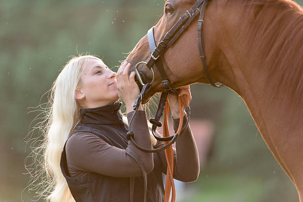 istock Young woman with horse 506990472