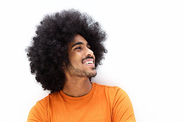 istock Smiling young man with cool hair looking away 506991018