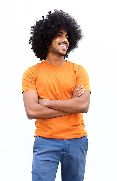 istock Smiling black guy with arms crossed isolated on white background 506991402