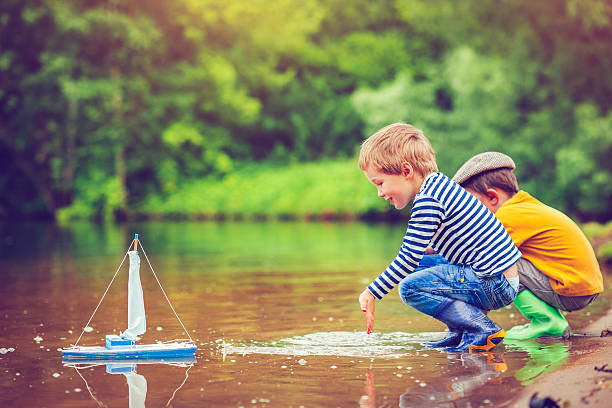 istock Children with toy ship 506991598