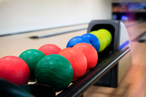 A Bowling Ball Rack Full Of Bowling Balls