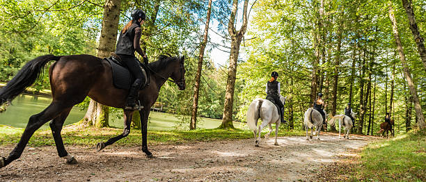 istock Women riding horses 506992982