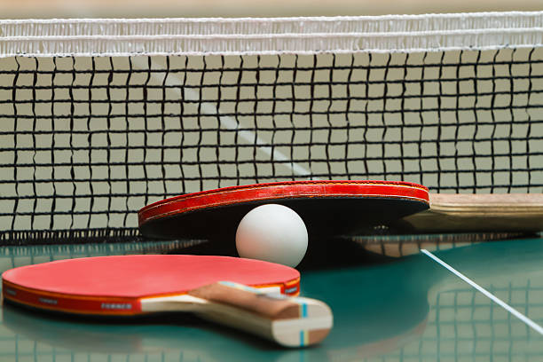 istock Tennis racket with a ball on the table 506994428
