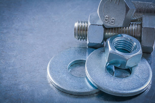istock Horizontal vertsion of bolt washers screwbolts nuts on metallic 506994714