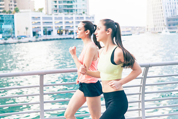 istock Young women running in urban setting 506994848