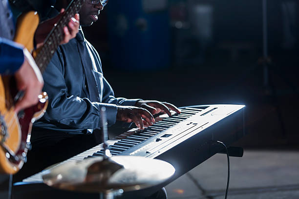 istock Close up of a musical band playing on stage 506995298