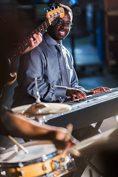 istock Close up of a musical band playing on stage 506995320