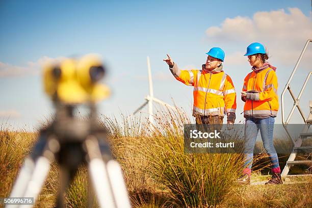 Male And Female Windfarm Engineers Stock Photo - Download Image Now - Construction Industry, Trainee, Engineer