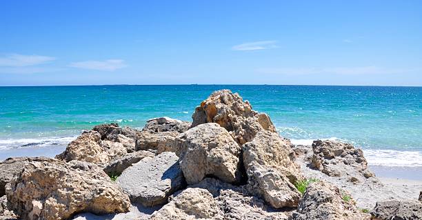 istock Rock Pile with Turquoise Seascape 506999454