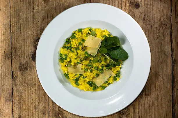 Photo of Leek, garden pea and saffron risotto looking down on plate