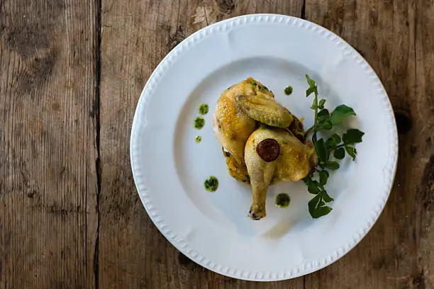 Photo of Roast poussin, crushed potato and chorizo with herb butter