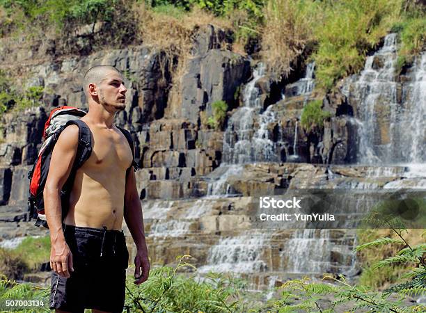 Mature Man With Backpack At Waterfall Pongour Close Up Looking Stock Photo - Download Image Now