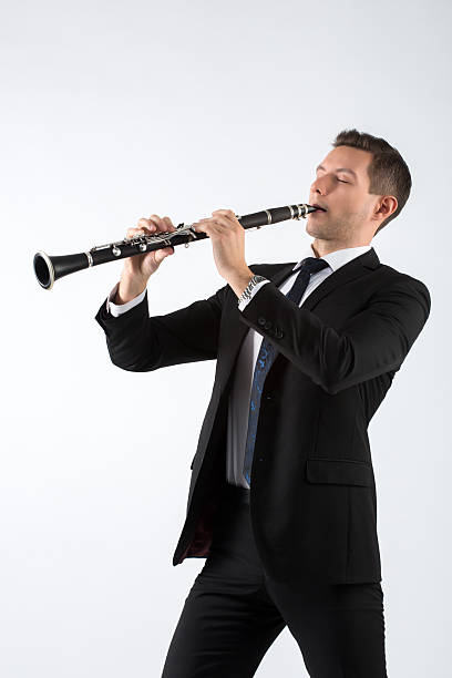 istock Young man playing the clarinet 507003806