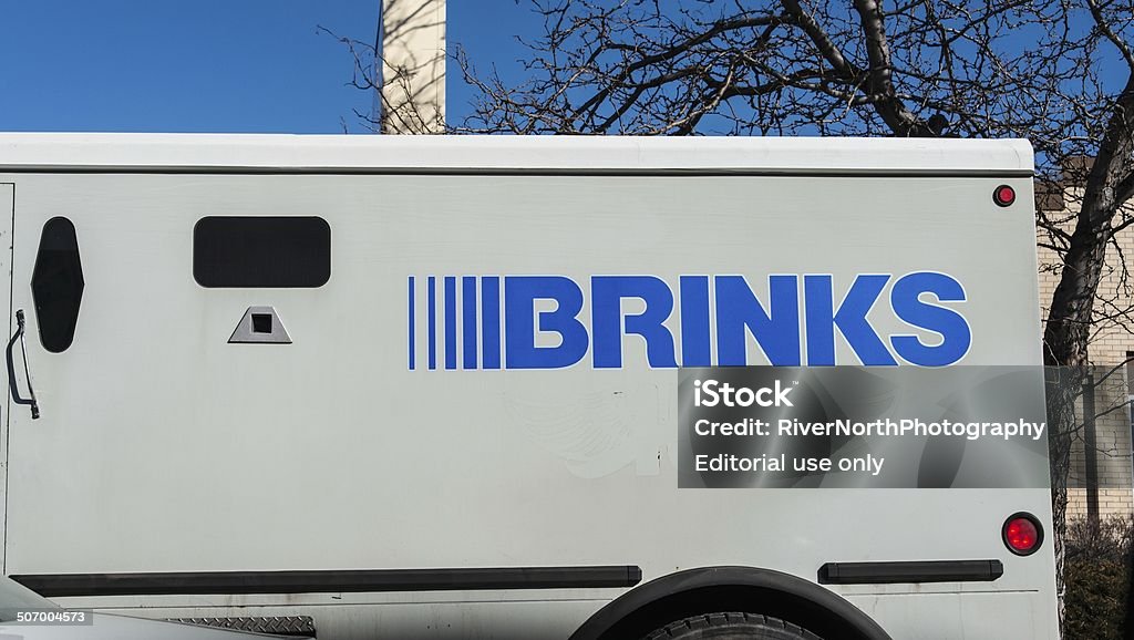 Brinks Fort Collins, Colorado, USA - February 19, 2014: A Brinks armored truck in Fort Collins. Brinks is a security firm that provides cash handling and security services to businesses. Armored Vehicle Stock Photo