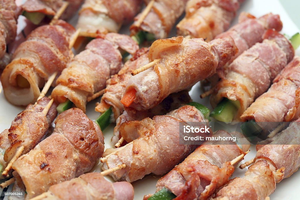 Bacon Rolls Close up of many Bacon Rolls on plate. Bacon Stock Photo