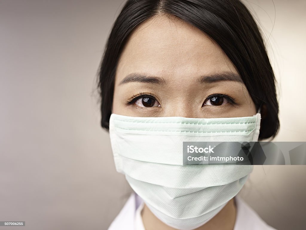 woman with mask face of a woman wearing a mask. Doctor Stock Photo