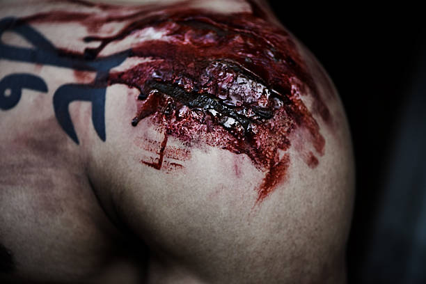 blut und gore - tattoo men human arm shoulder stock-fotos und bilder