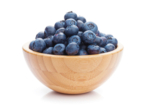 Blueberries in bowl. Isolated on white background