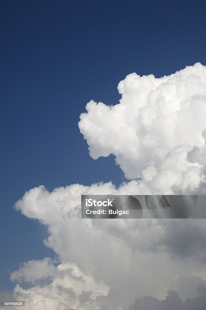 Fluffy Clouds Big white fluffy clouds on the blue sky. Blue Stock Photo