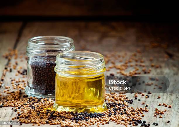 Oil From The Seeds Of The Black Mustard Stock Photo - Download Image Now - Cooking Oil, Mustard, Black Color