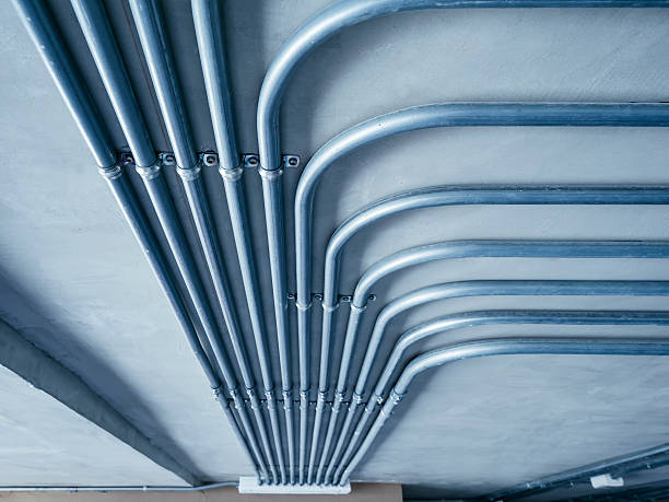 Electricity Pipe system on Cement Wall stock photo
