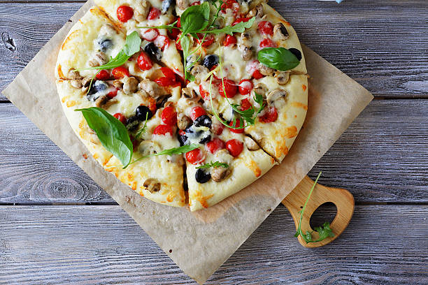 istock pizza with tomatoes and mushrooms 507028132