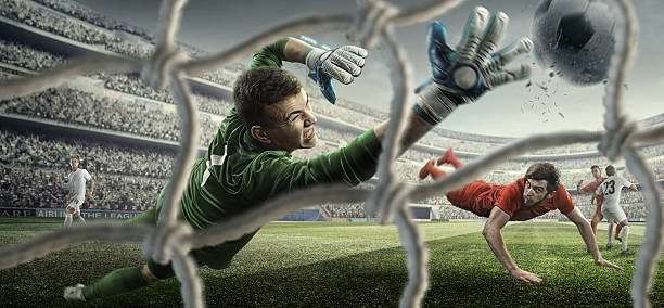 piłka nożna gry moment z goalkeeper - soccer shoe soccer player kicking soccer field zdjęcia i obrazy z banku zdjęć