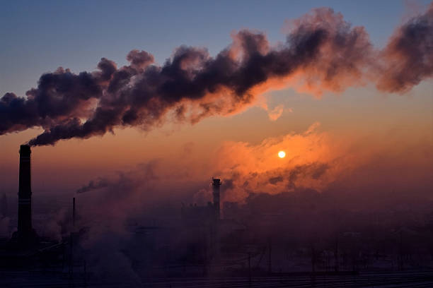 istock Smoking chimneys at sunrise 507028582