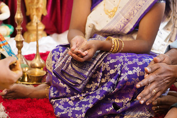 istock Woman received prayers from priest. 507029566