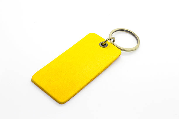 couro amarelo porta-chaves - close up shiny merchandise rough imagens e fotografias de stock